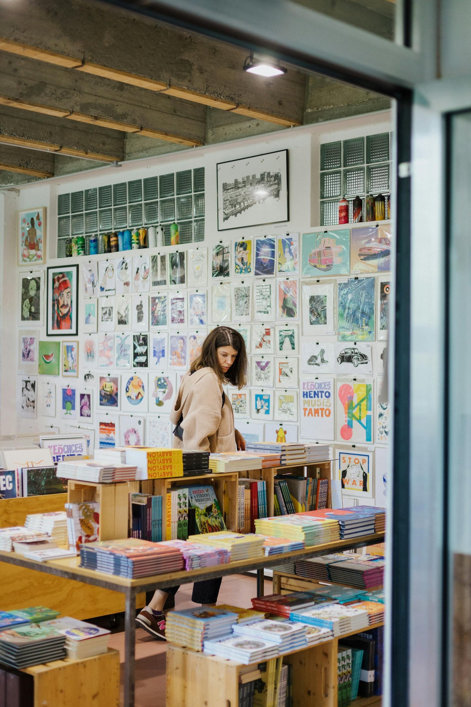 Explore a vibrant bookstore in Bratislava with colorful art and cozy ambience.